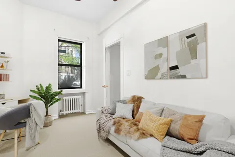 a living room with furniture and windows