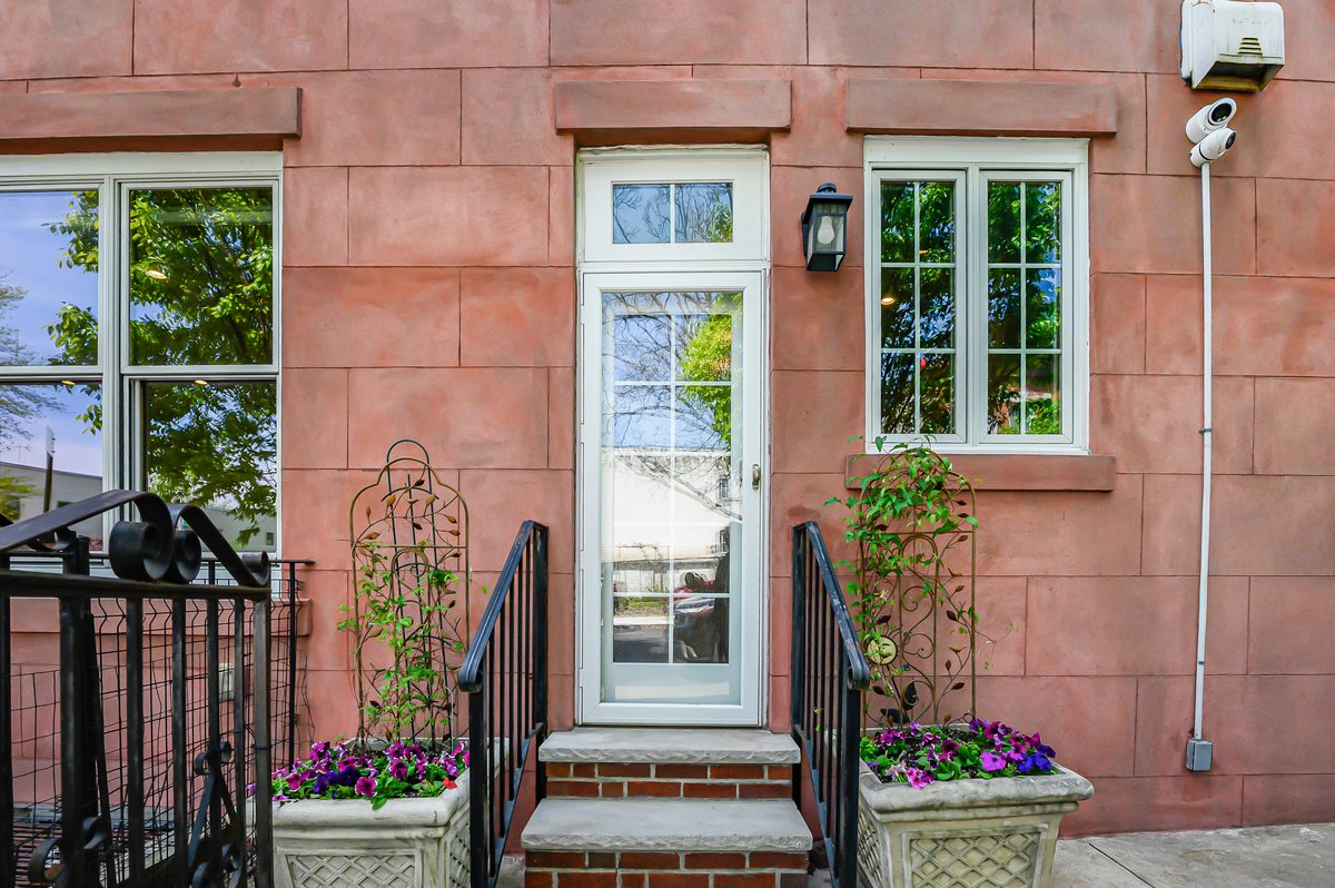 1702 11th Avenue Brooklyn, NY 11218 - Photo 21 of 25 a front view of a house with a garden