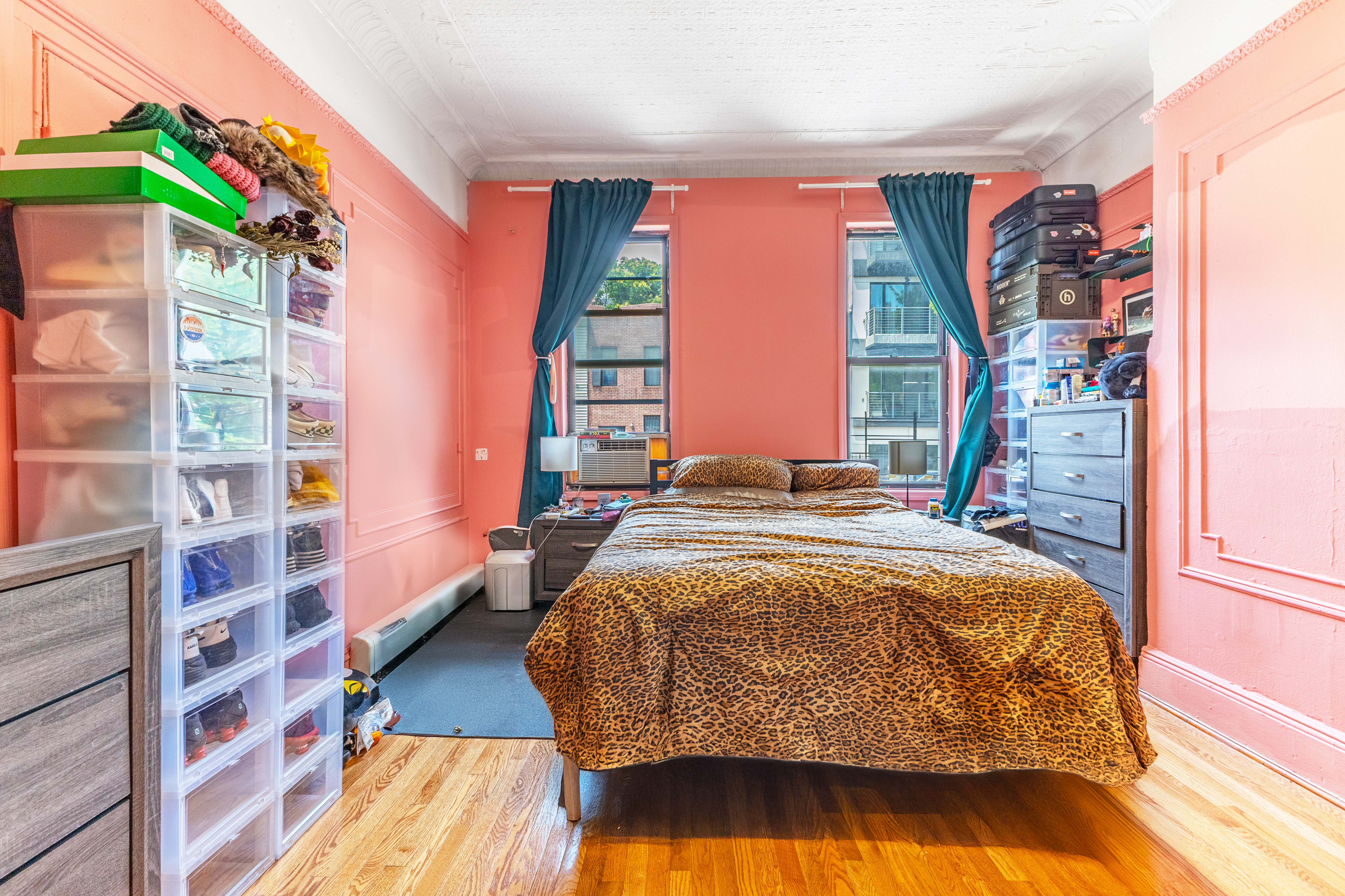 52 Himrod Street Brooklyn, NY 11221 - Photo 4 of 16 a bed sitting in a bedroom next to a window