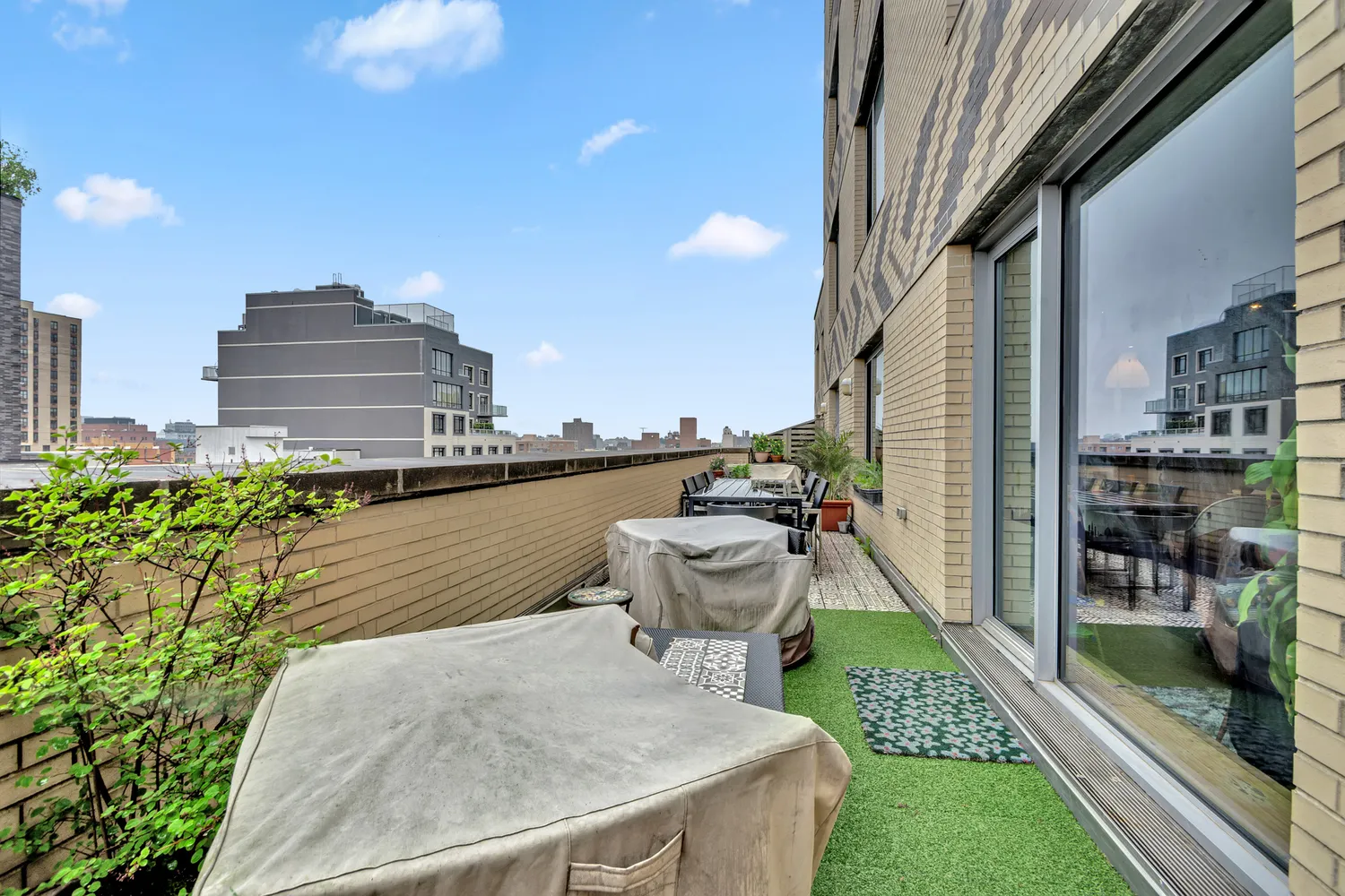 a swimming pool with outdoor seating and plants