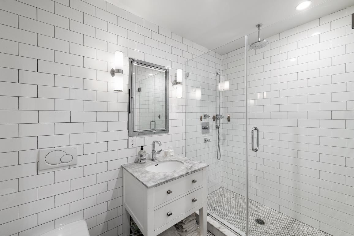 49 Summit Street, Unit 1C Brooklyn, NY 11231 - Photo 7 of 10 a bathroom with a sink shower and a mirror