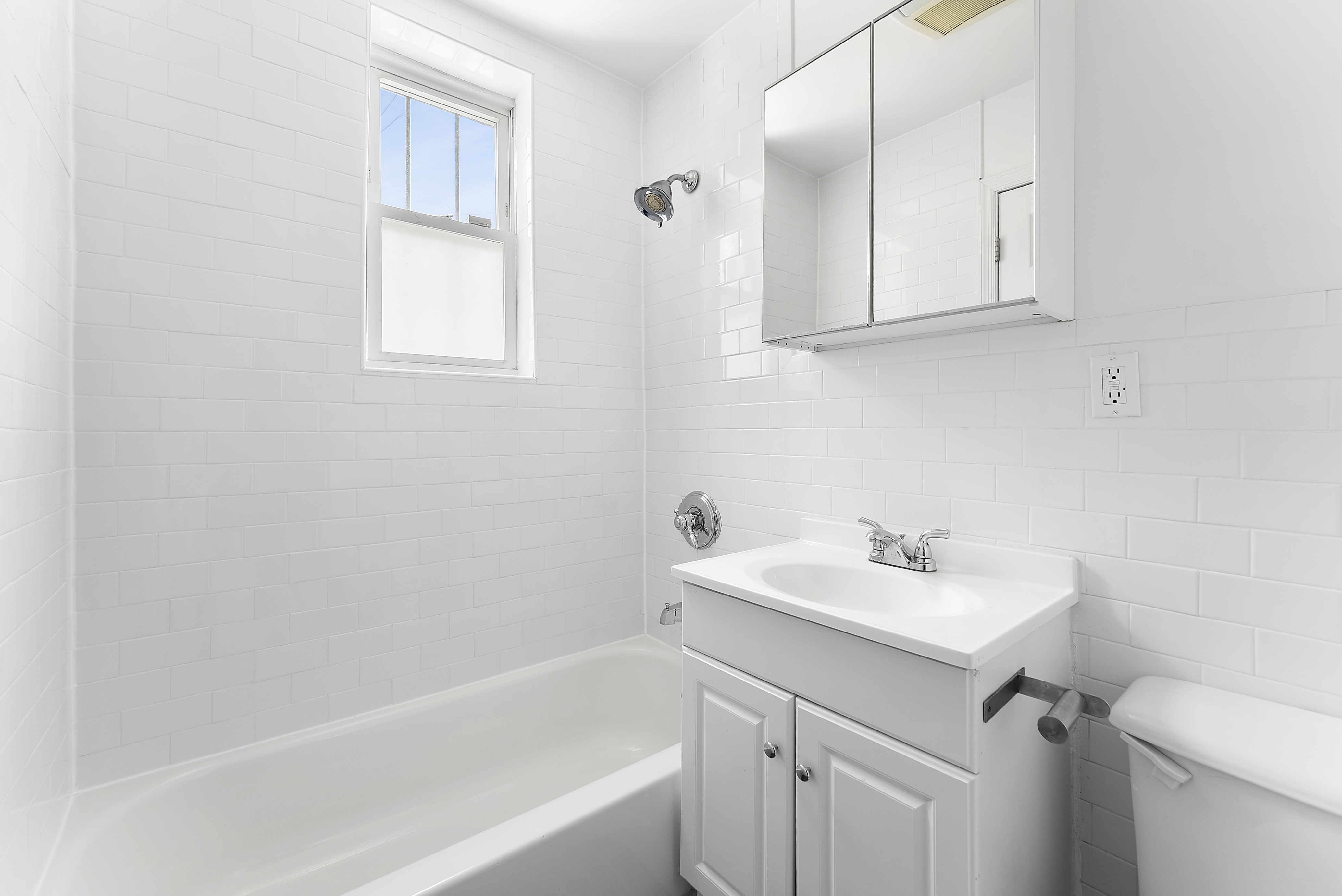 768 Hart Street, Unit 1 Brooklyn, NY 11237 - Photo 13 of 18 a bathroom with a sink toilet and vanity