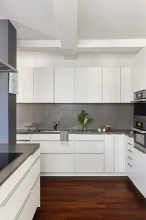 a kitchen with a sink and cabinets