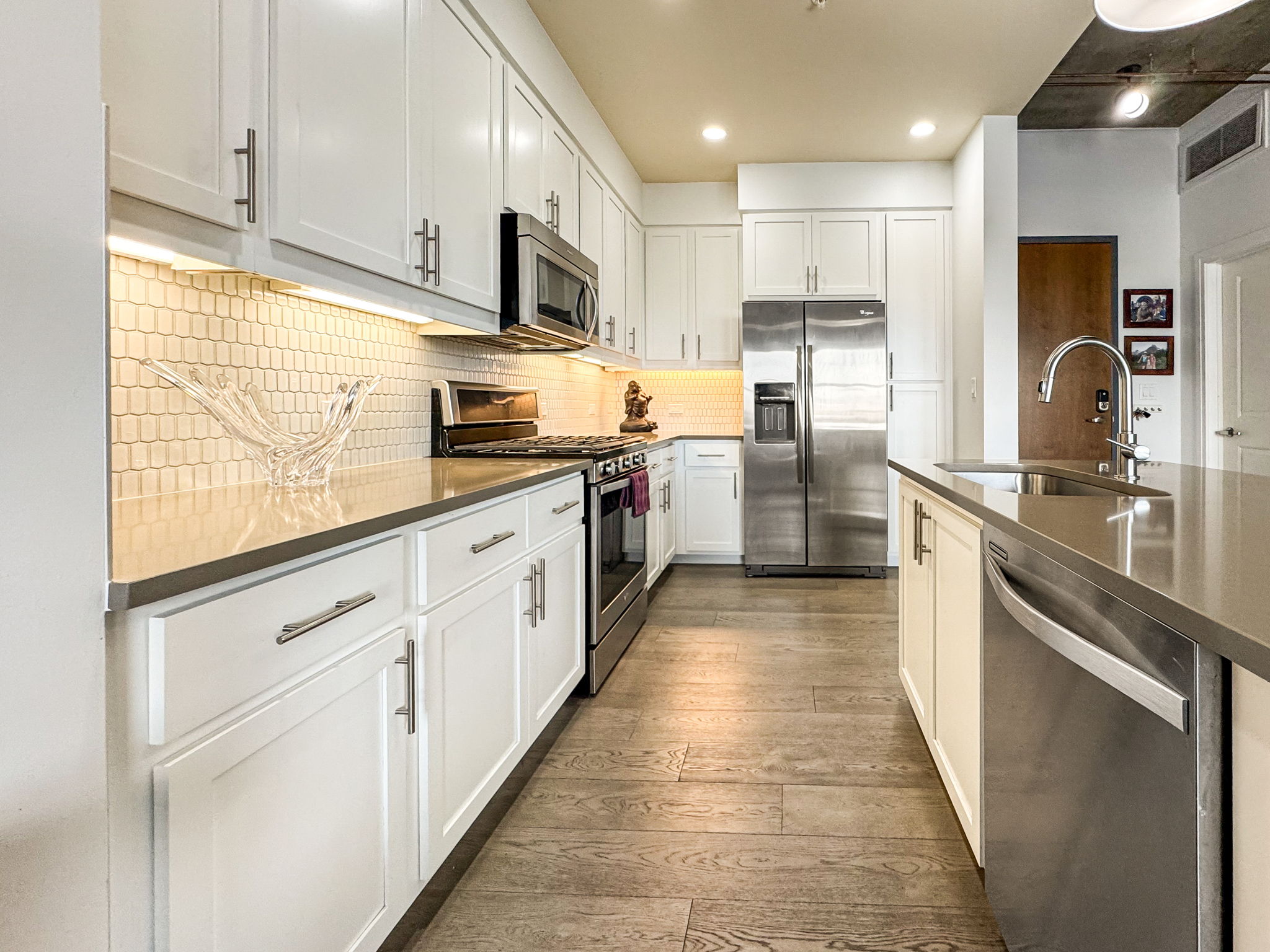 3401 Arapahoe Avenue, Unit Undisclosed Boulder, CO 80303 - Photo 2 of 28 a large kitchen with stainless steel appliances lots of counter space sink and cabinets