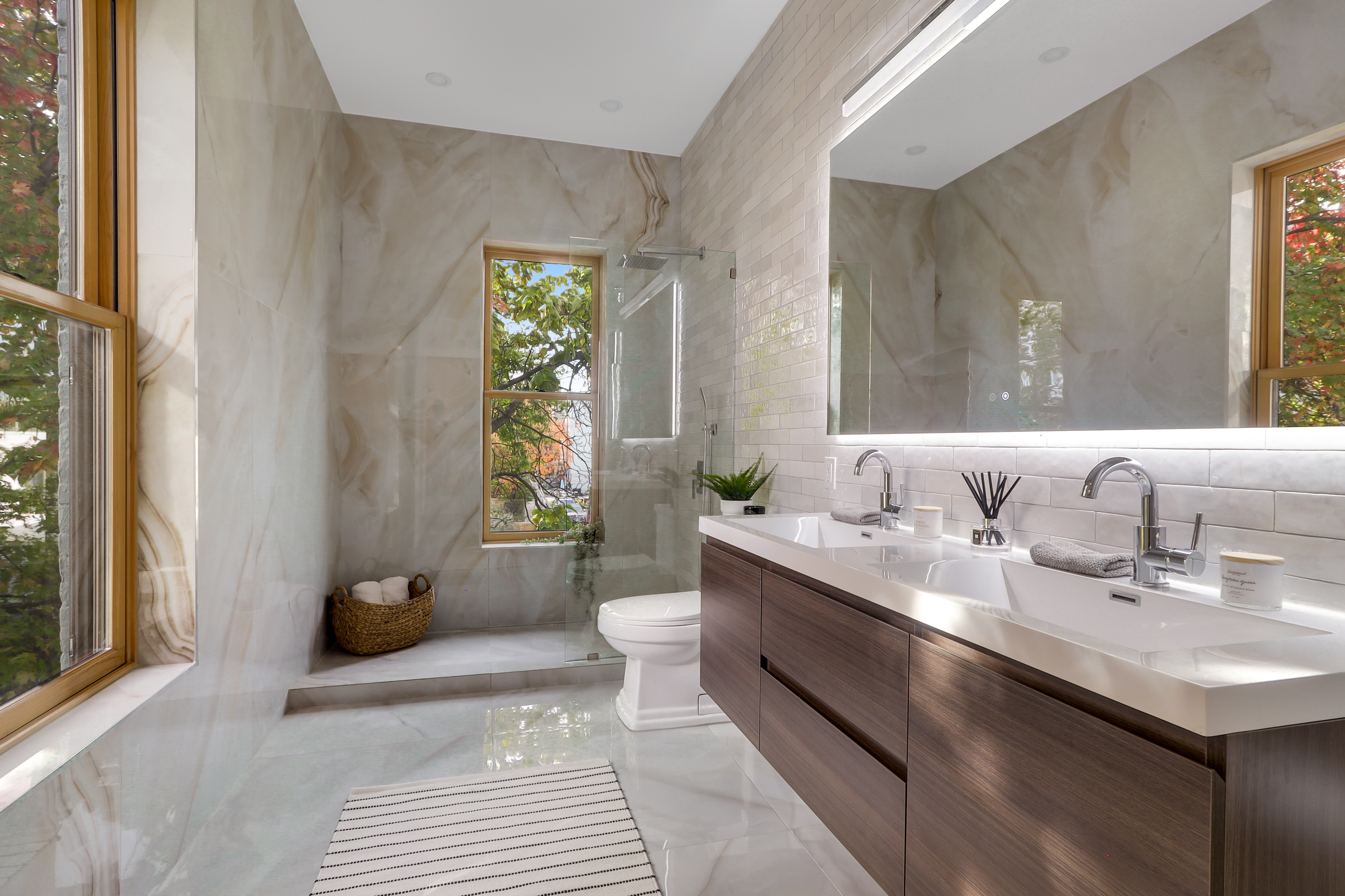 220 Lewis Avenue Brooklyn, NY 11221 - Photo 14 of 22 a bathroom with a granite countertop sink and a mirror