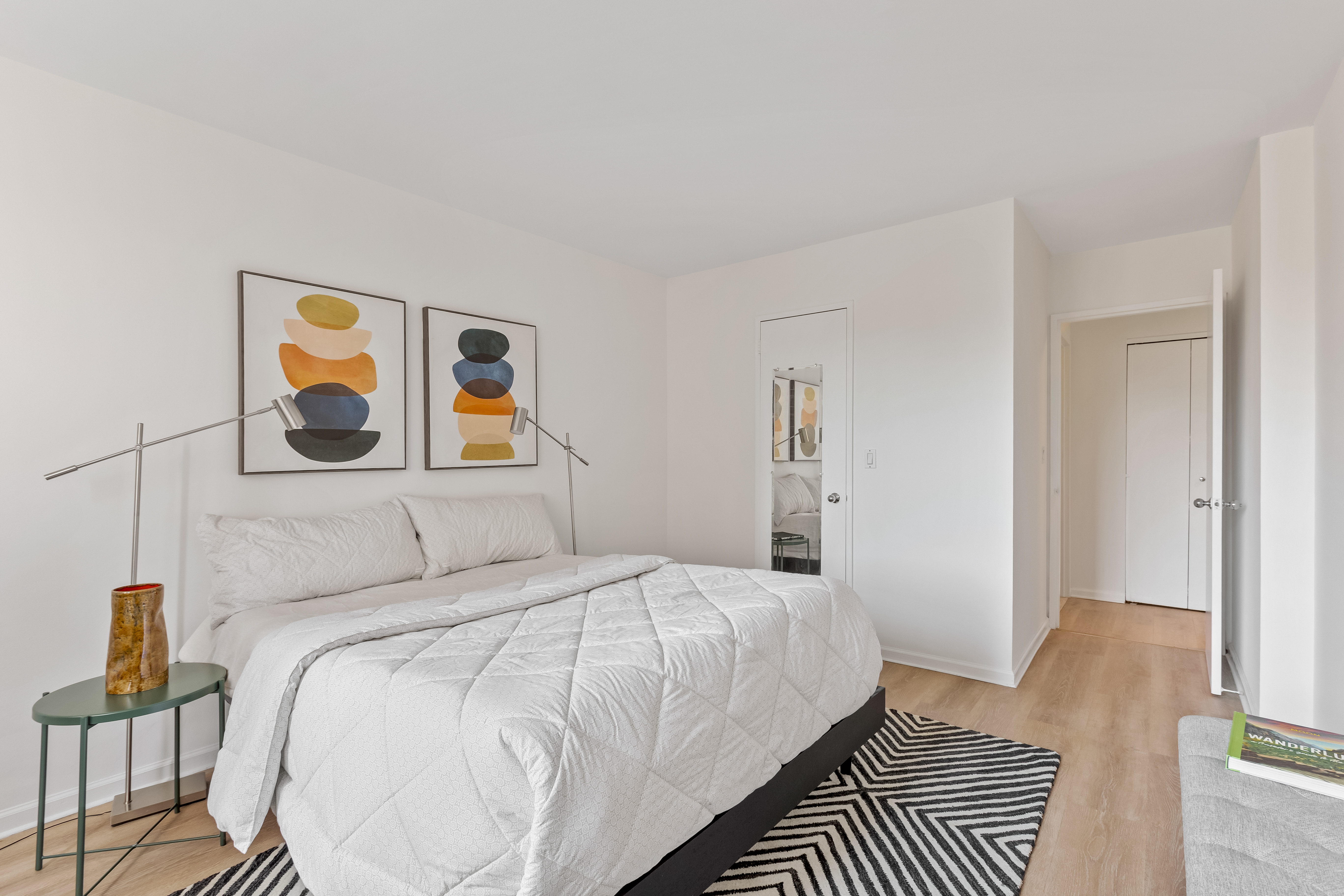 157 East 32nd Street, Unit 8A Manhattan, NY 10016 - Photo 7 of 16 a bedroom with a bed and a painting on the wall