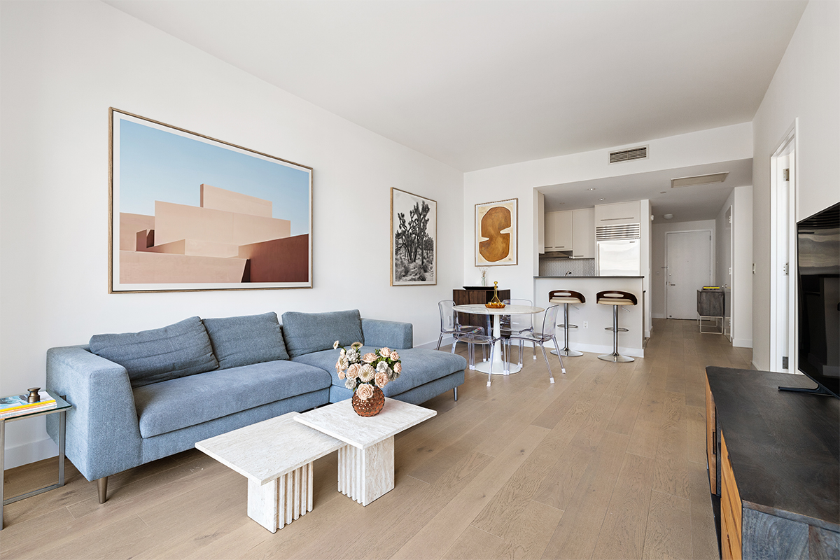 255 Hudson Street, Unit 7C Manhattan, NY 10013 - Photo 3 of 9 a living room with furniture and wooden floor