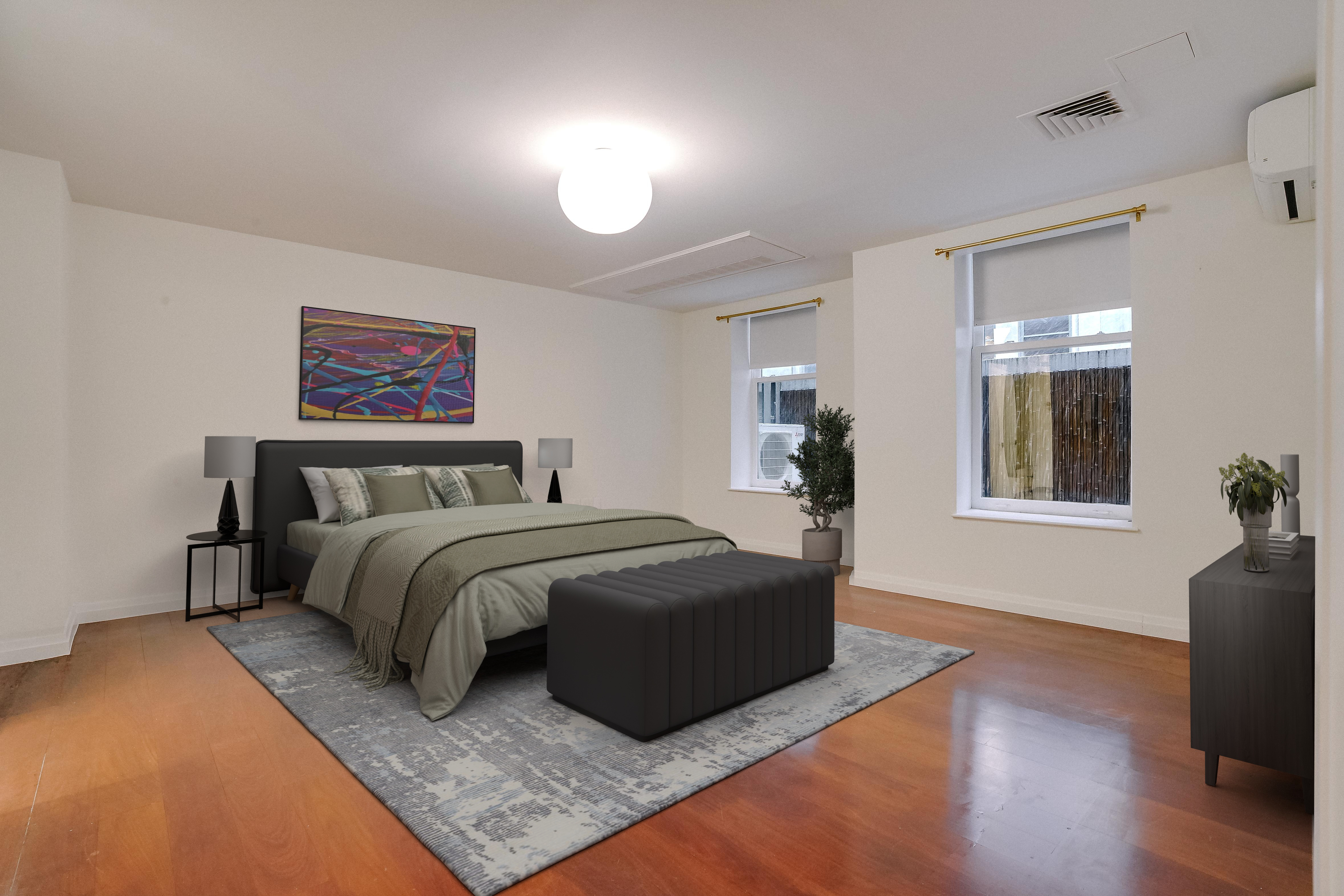 55 Wall Street, Unit PH910 Manhattan, NY 10005 - Photo 10 of 19 a spacious bedroom with a bed and wooden floor