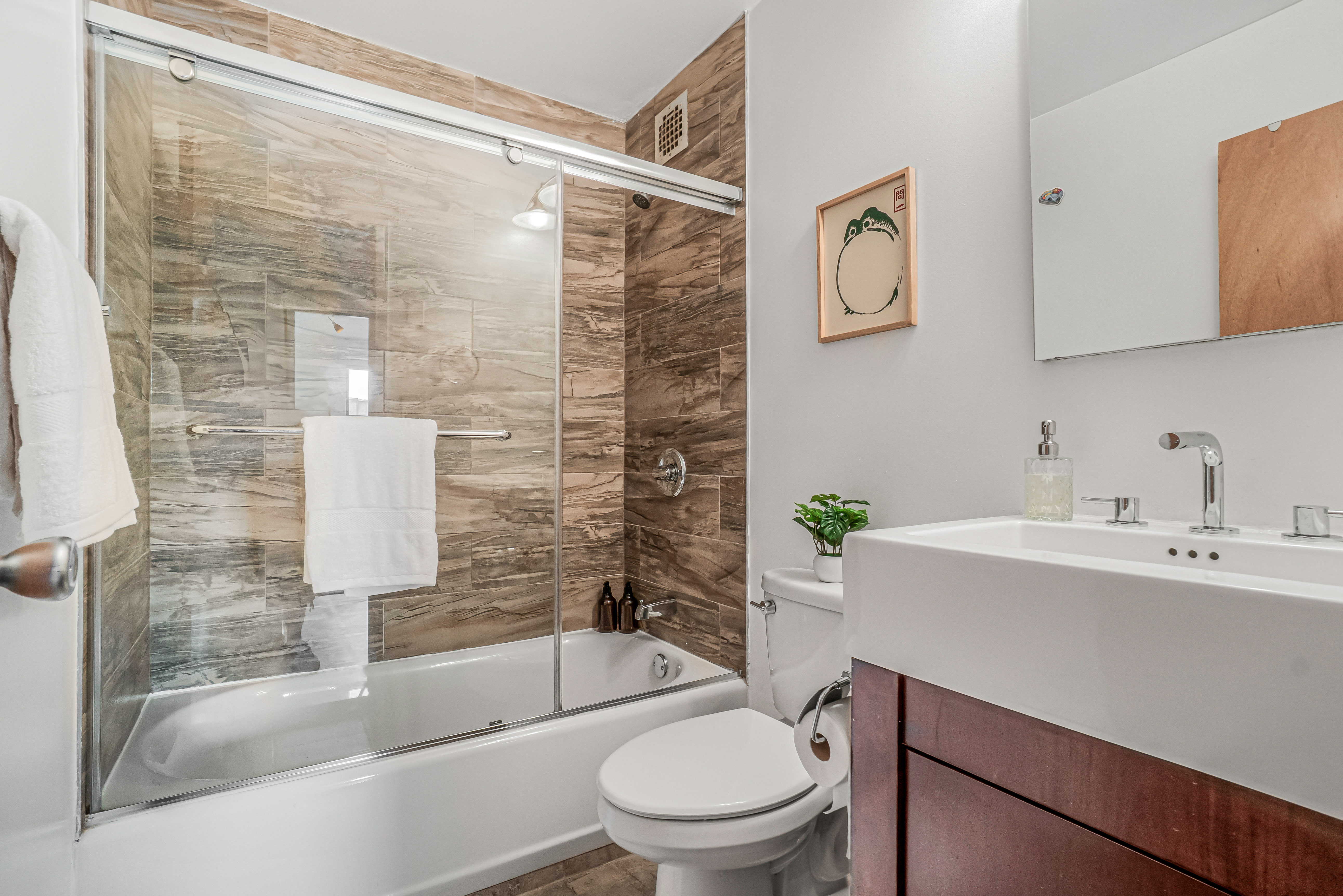 7 Gates Avenue, Unit H Brooklyn, NY 11238 - Photo 12 of 20 a bathroom with a sink toilet and shower