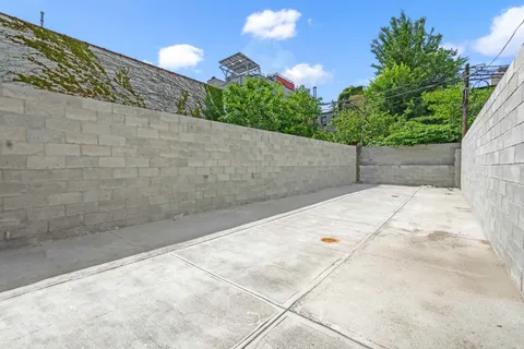 a living room with furniture a flat screen tv and couches