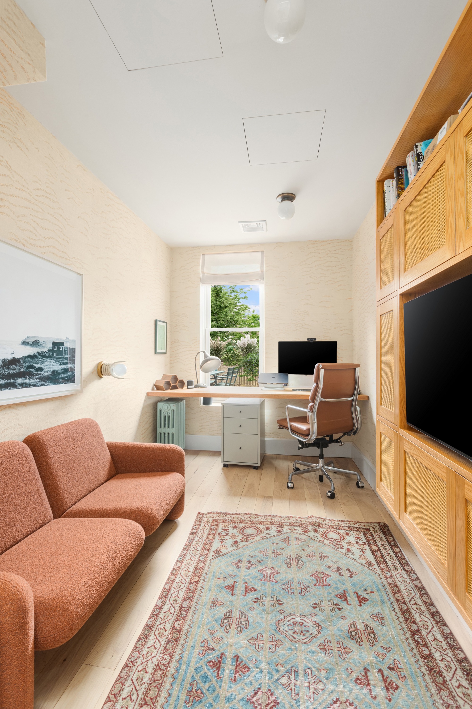 152 Underhill Avenue Brooklyn, NY 11238 - Photo 9 of 20 a living room with furniture and a flat screen tv