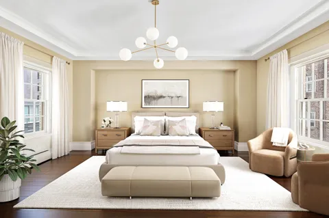 a bedroom with bed and wooden floor