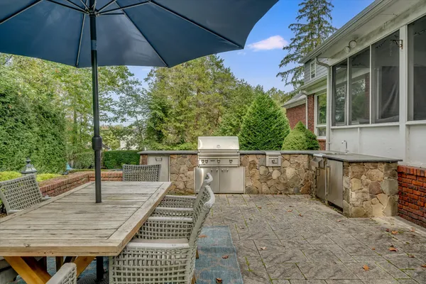 a view of a backyard with sitting area