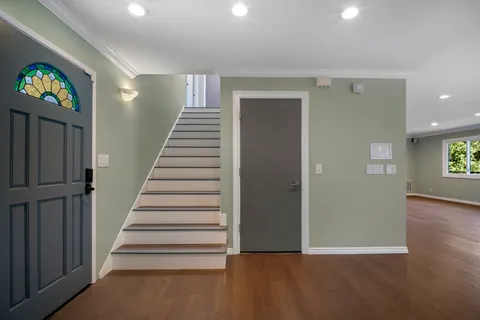 a view of entryway with wooden floor