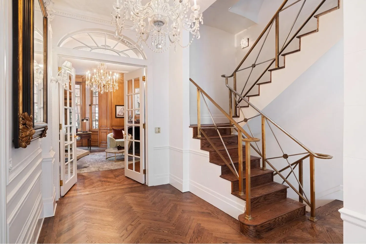 a view of entryway and hall with wooden floor