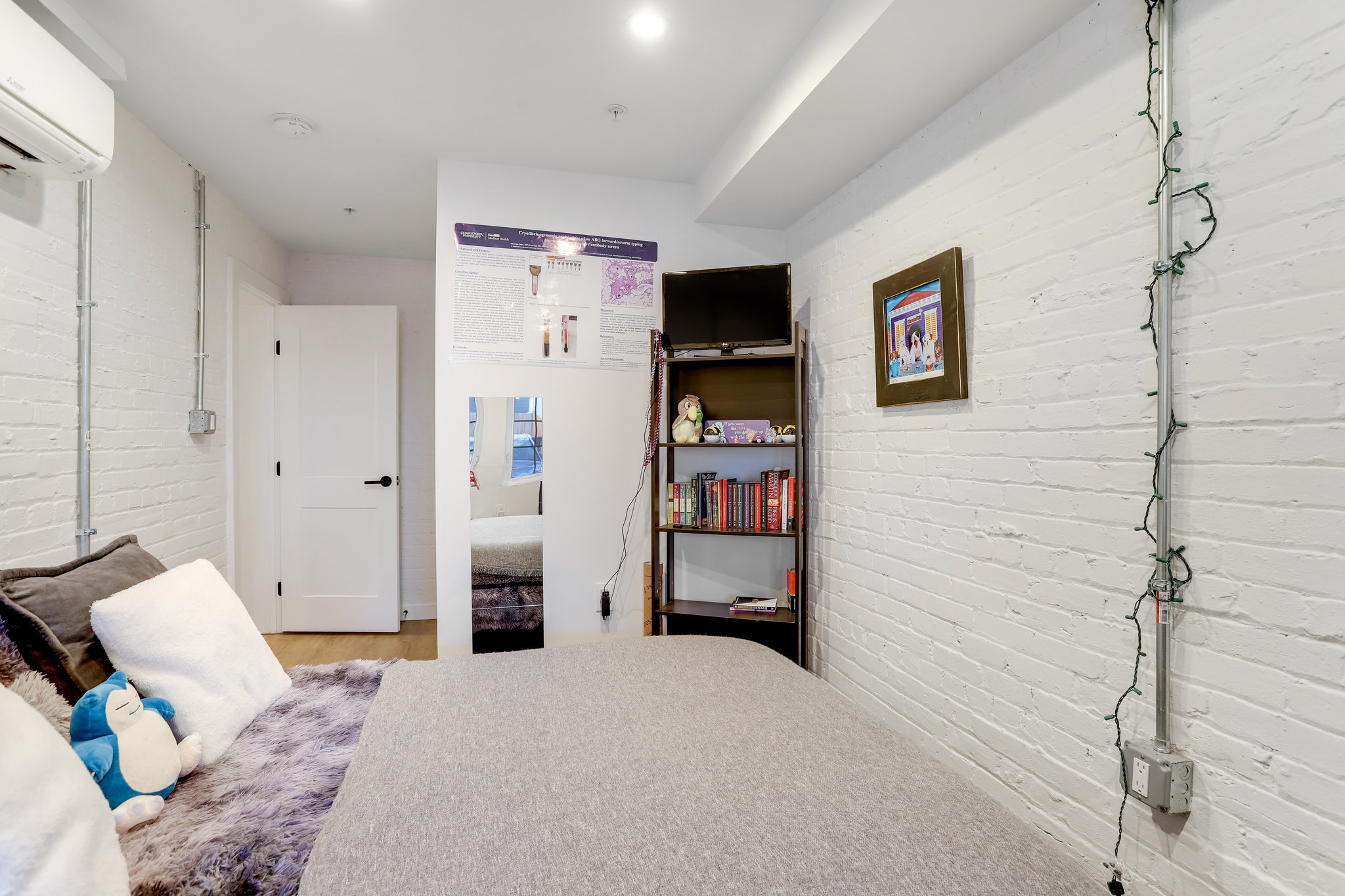 1920 35th Street Northwest Washington, DC 20007 - Photo 44 of 54 a bedroom with a bed and a television
