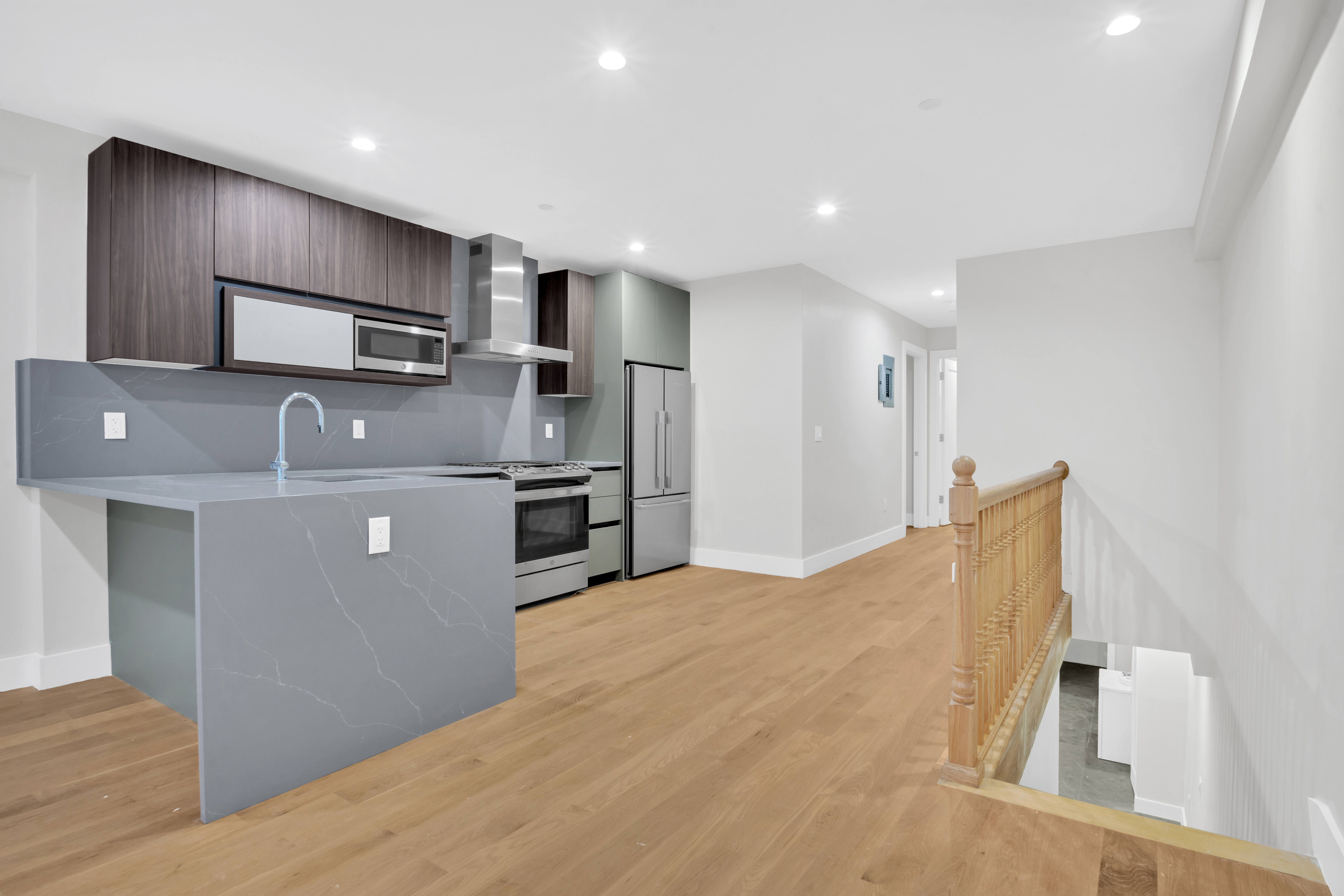 265 West 131st Street, Unit GARDEN Manhattan, NY 10027 - Photo 5 of 11 a kitchen with stainless steel appliances granite countertop a refrigerator sink and microwave
