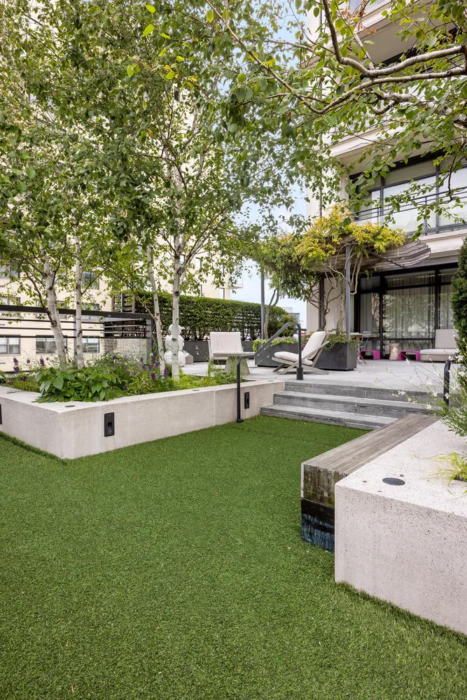 a swimming pool with outdoor seating and yard