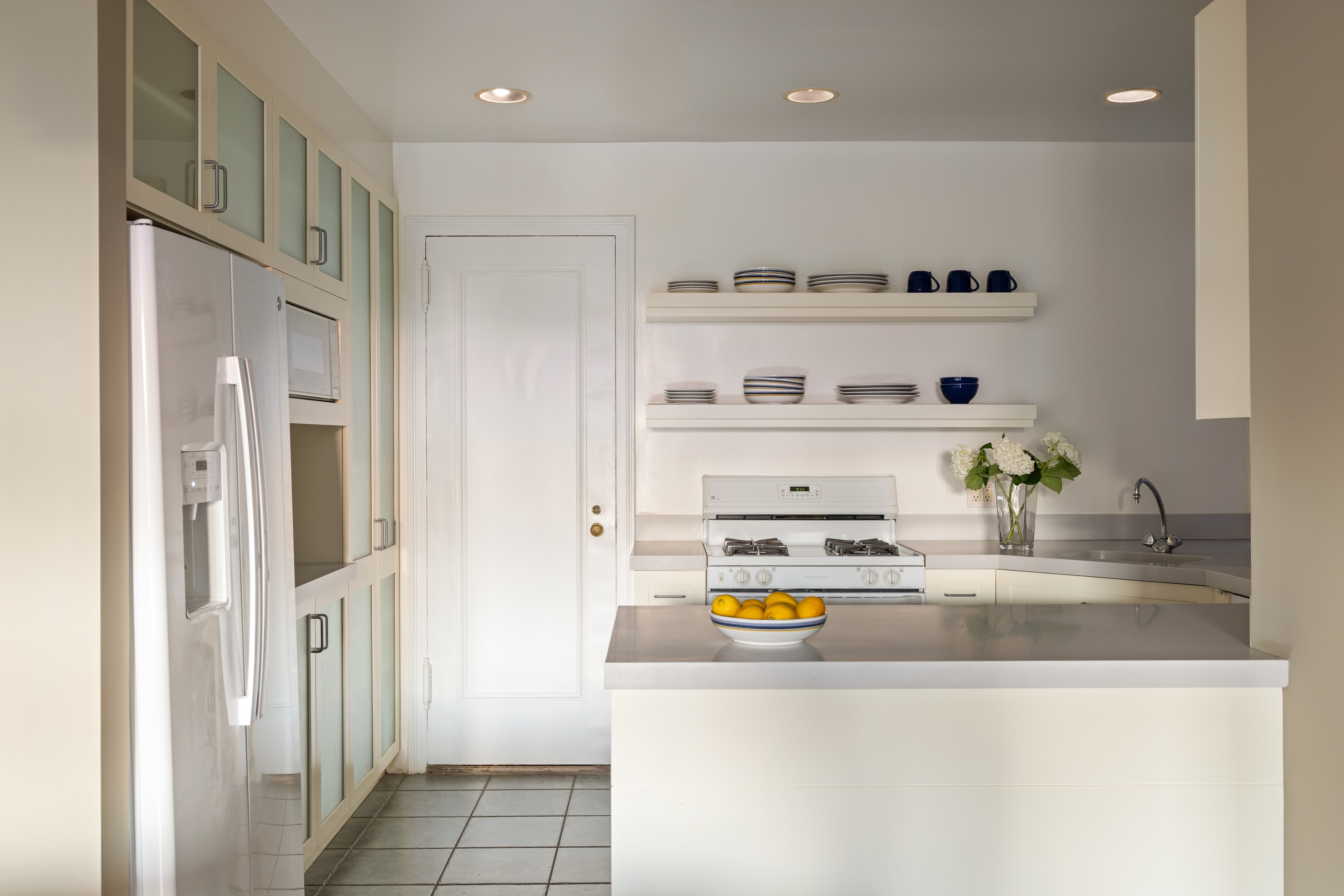 186 Riverside Drive, Unit 5F Manhattan, NY 10024 - Photo 6 of 15 a kitchen with stainless steel appliances granite countertop a refrigerator and a stove