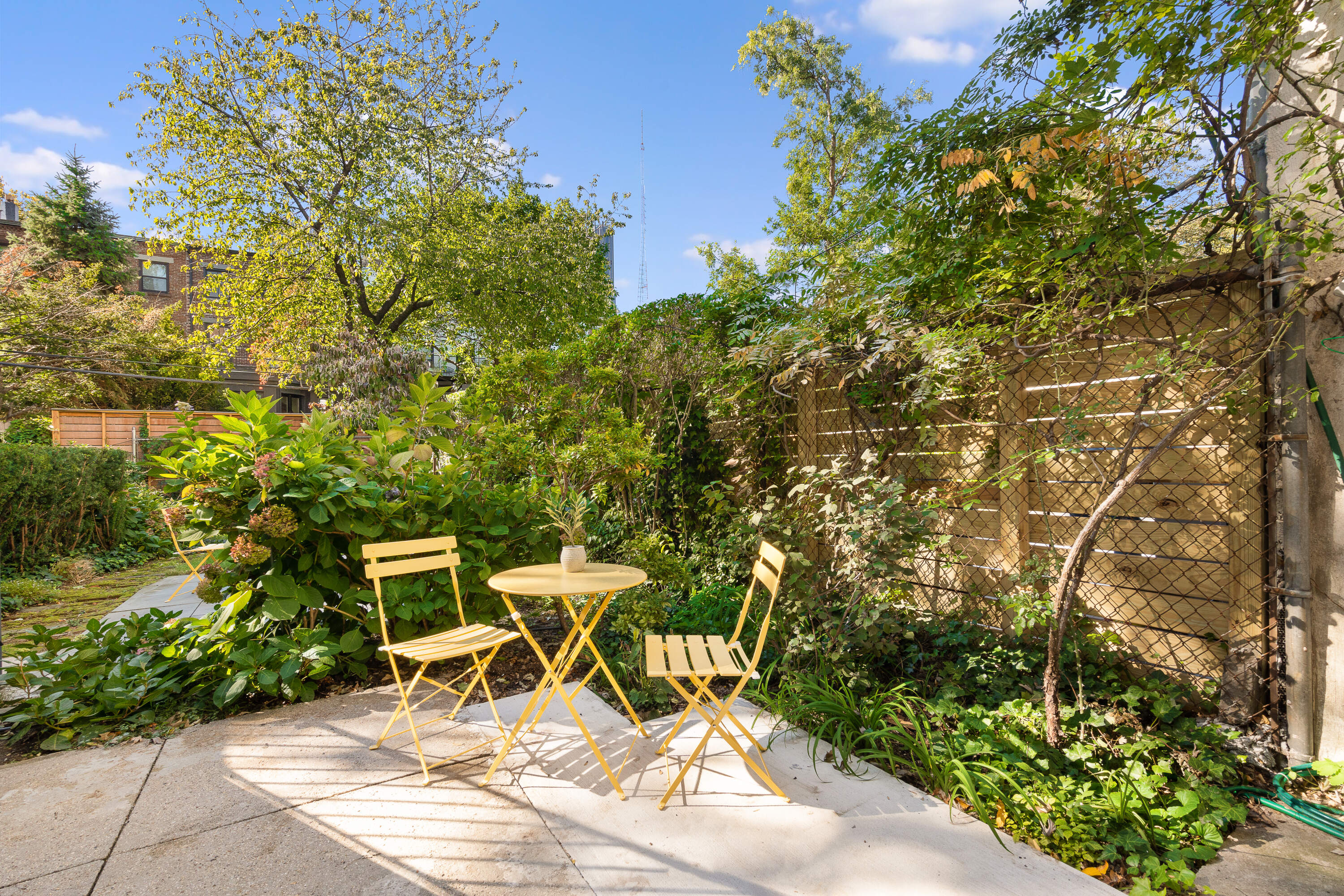 250 Cumberland Street, Unit GARDEN Brooklyn, NY 11205 - Photo 1 of 5 a view of a chairs and table in a backyard