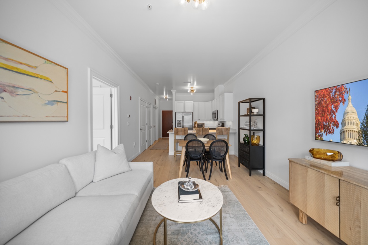 1210 R Street Northwest, Unit 213 Washington, DC 20009 - Photo 2 of 3 a living room with furniture and a dining table