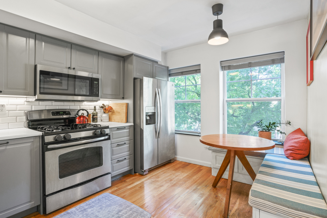 95 Vanderbilt Avenue, Unit AA Brooklyn, NY 11205 - Photo 4 of 11 a kitchen with stainless steel appliances a stove a sink and a refrigerator