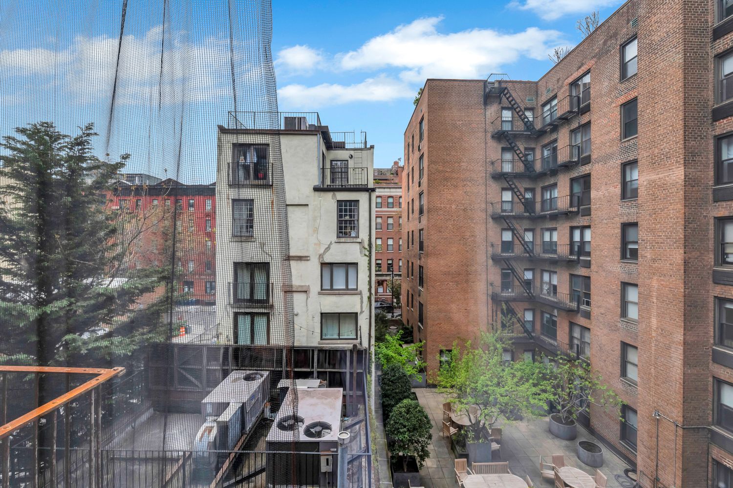 223 West 10th Street, Unit 2C Manhattan, NY 10014 - Photo 8 of 11 a city view with tall buildings