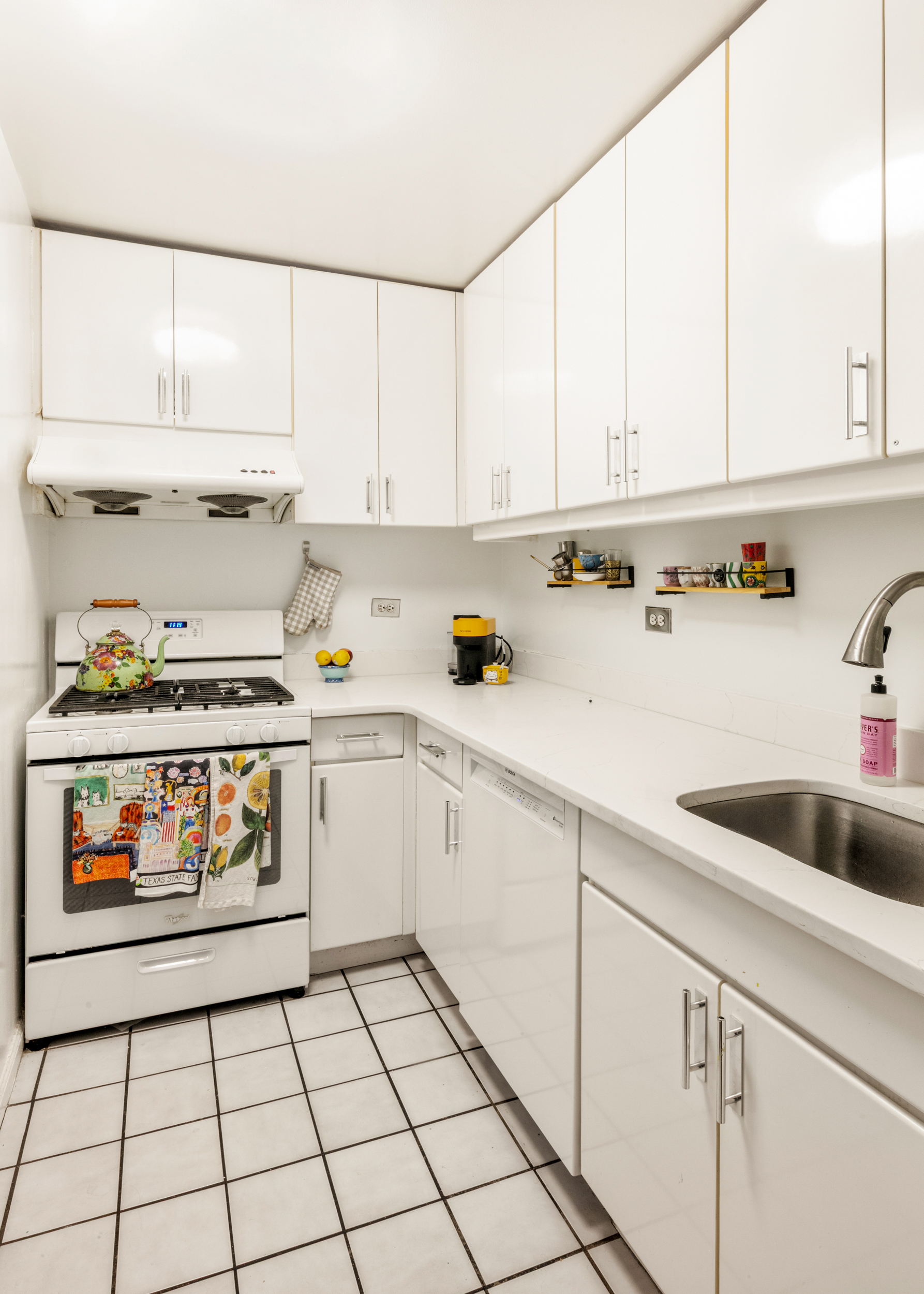 275 Greenwich Street, Unit 2A Manhattan, NY 10007 - Photo 3 of 8 a kitchen with appliances cabinets and a sink