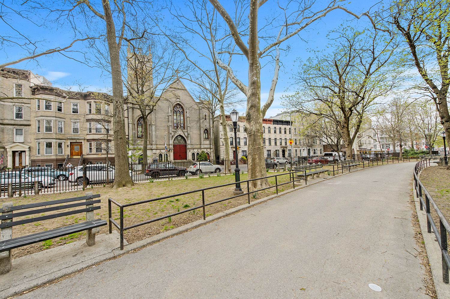 a view of a building with large trees