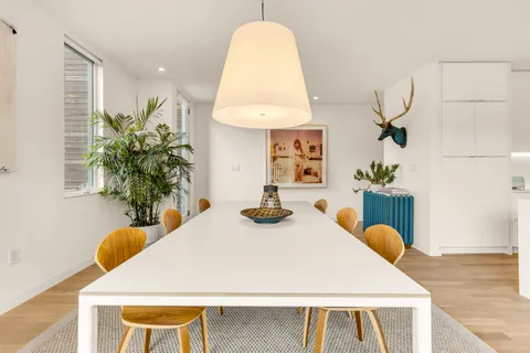 a dining room with table and chairs