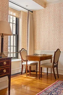 a living room filled with furniture and a table