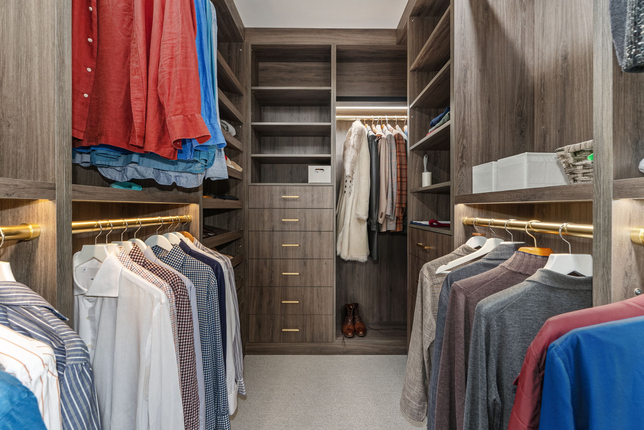 230 Central Park South, Unit 6DE Manhattan, NY 10019 - Photo 13 of 23 a view of walk in closet with clothes and shoes