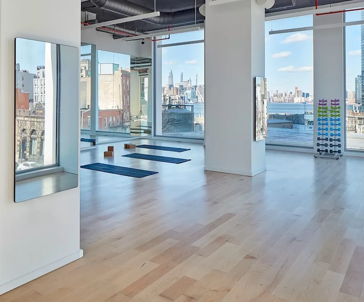 a view of an entryway with wooden floor and windows