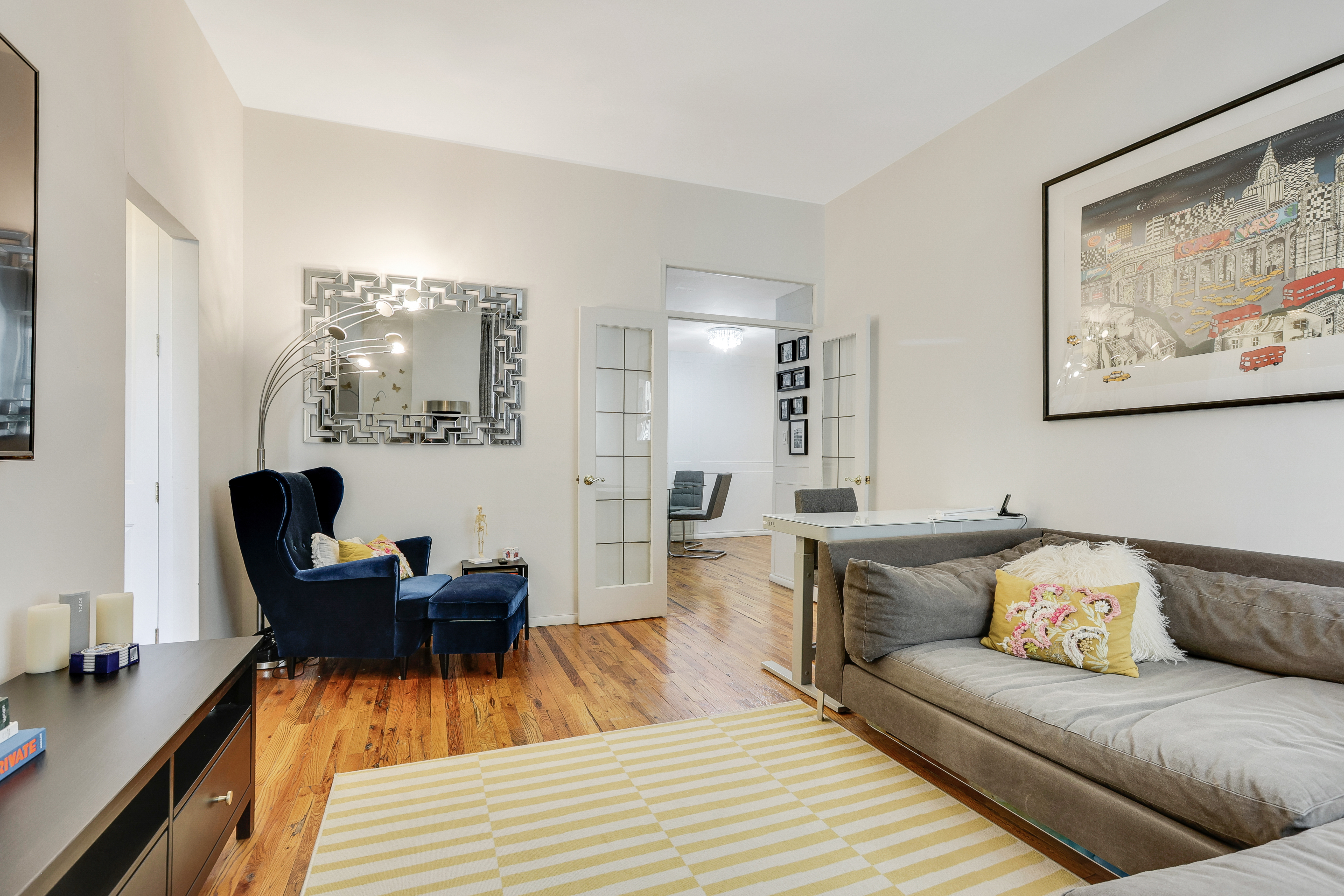 159 Madison Avenue, Unit 4G Manhattan, NY 10016 - Photo 2 of 14 a living room with furniture and a wooden floor