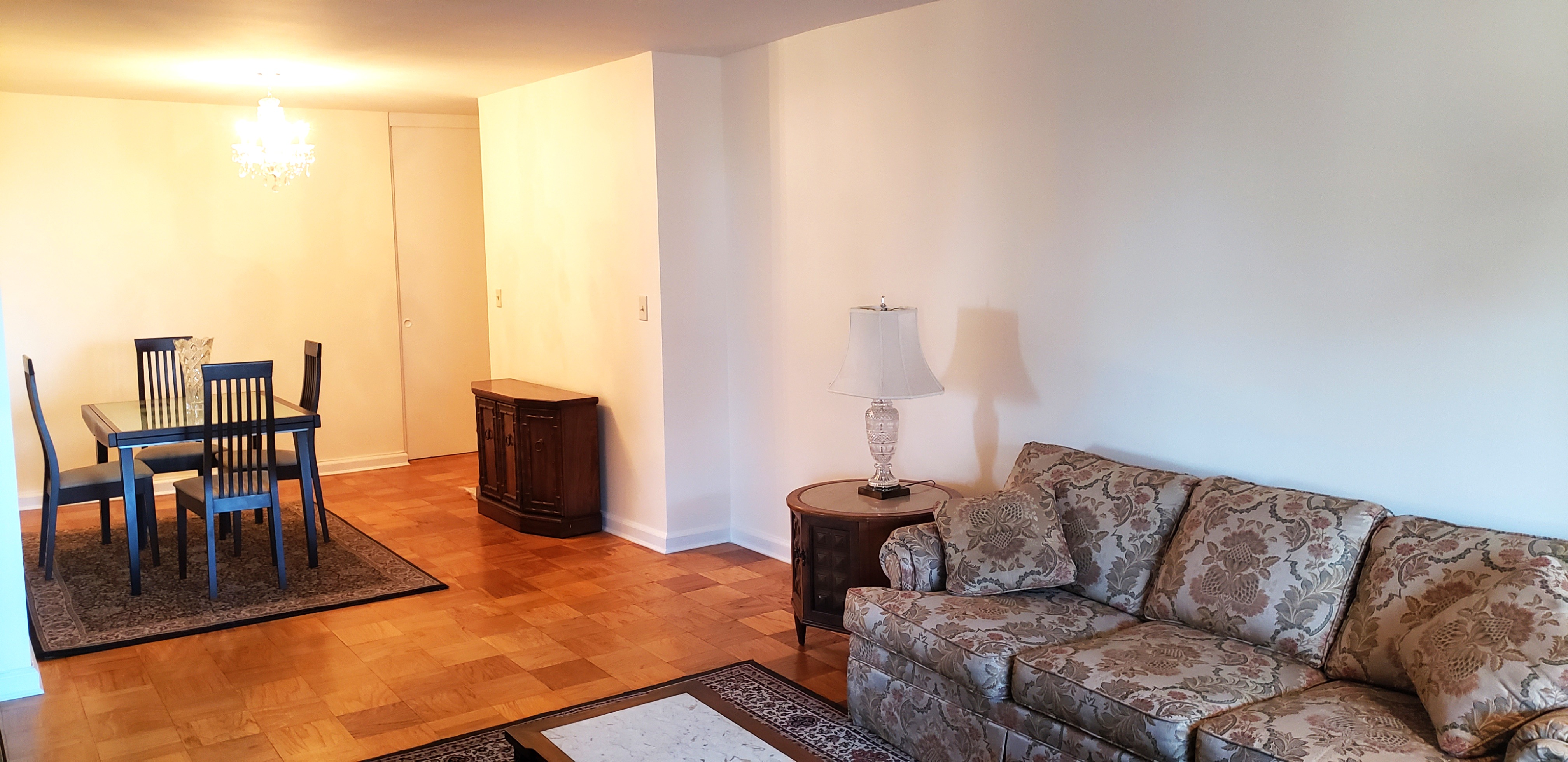 70-25 Yellowstone Boulevard, Unit 11D Queens, NY 11375 - Photo 2 of 25 a living room with furniture and a flat screen tv