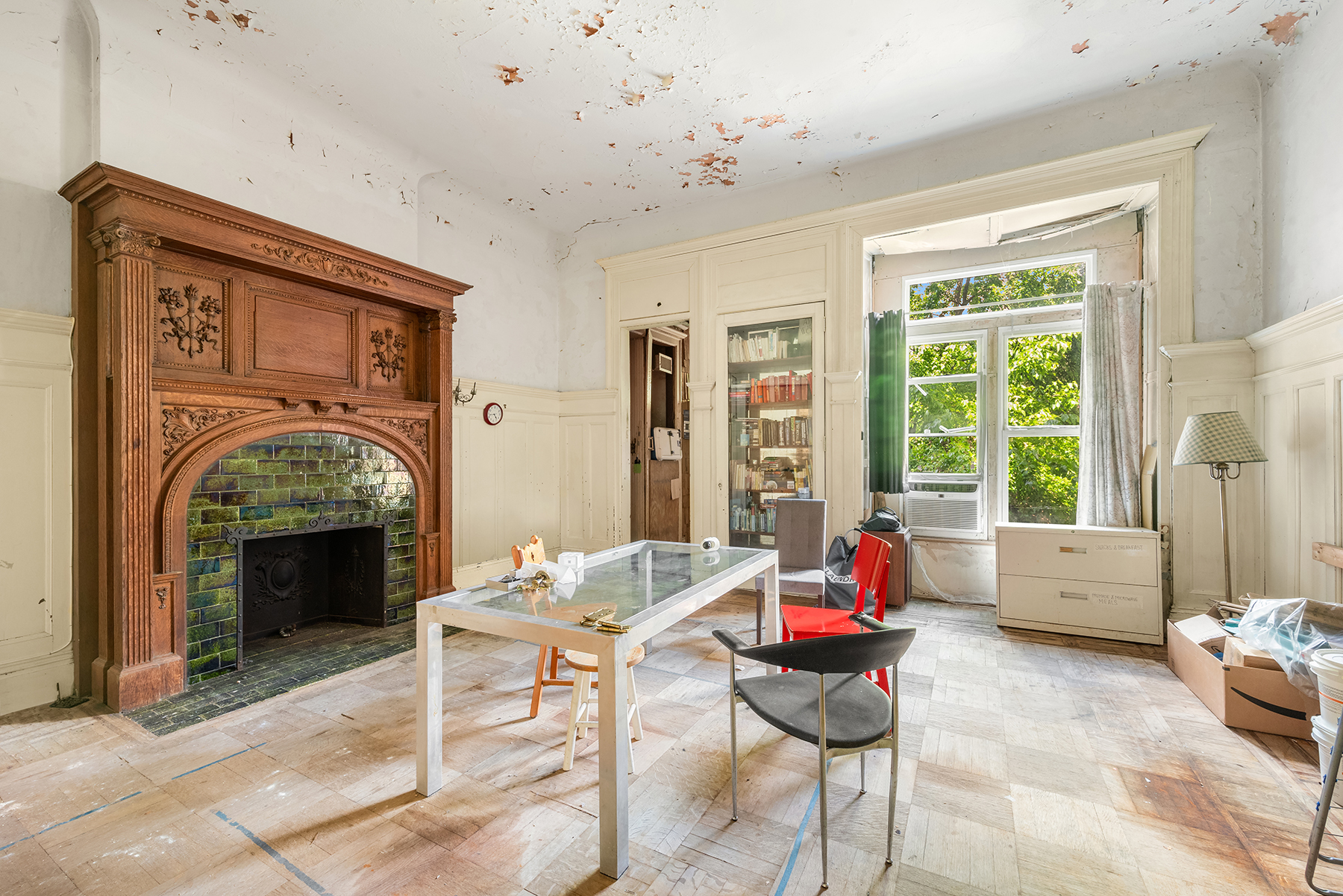 131 West 118th Street Manhattan, NY 10026 - Photo 3 of 8 a living room with furniture and a fireplace