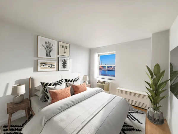 a bed room with furniture and a potted plant