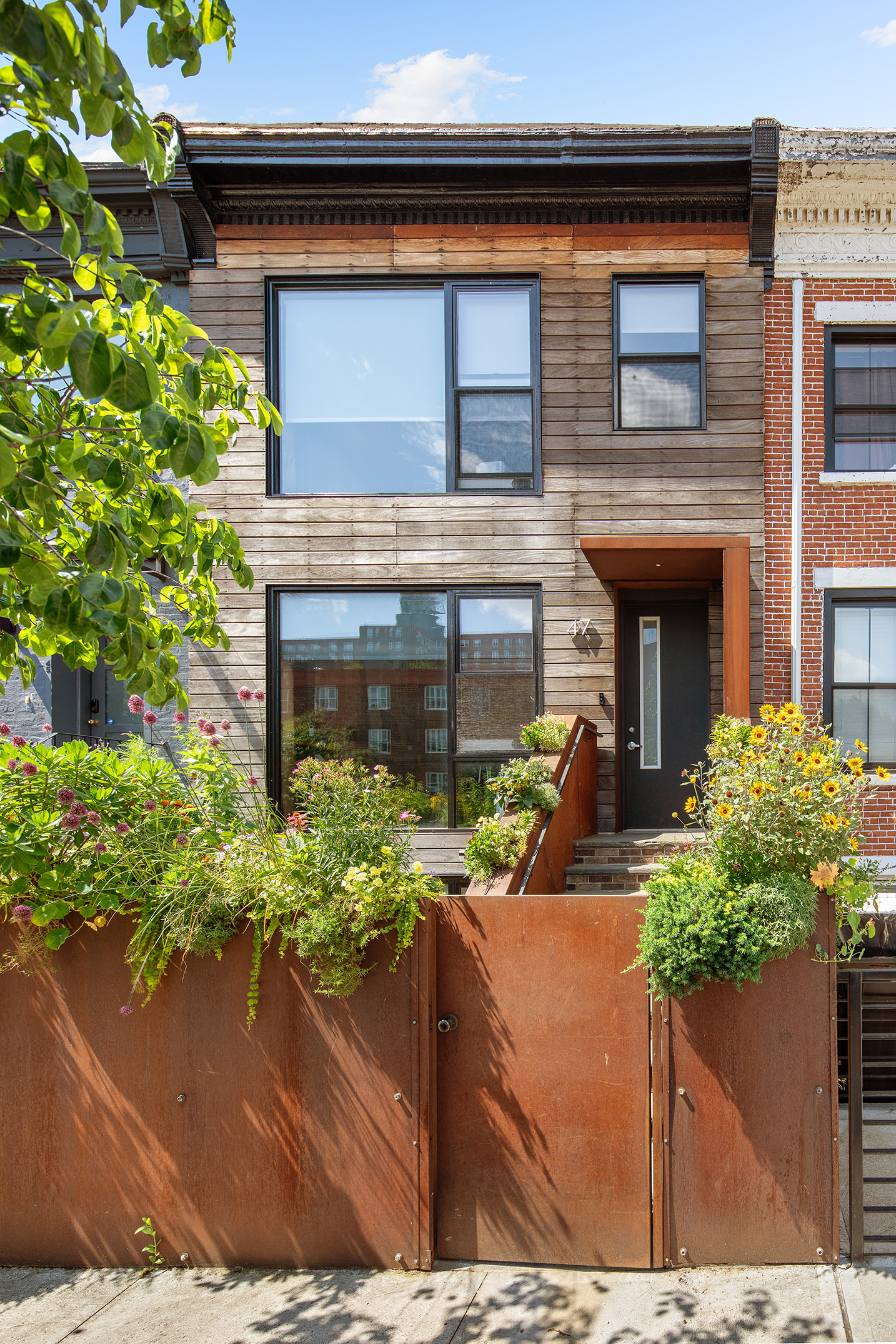 47 Wolcott Street Brooklyn, NY 11231 - Photo 23 of 24 a front view of a house with a yard