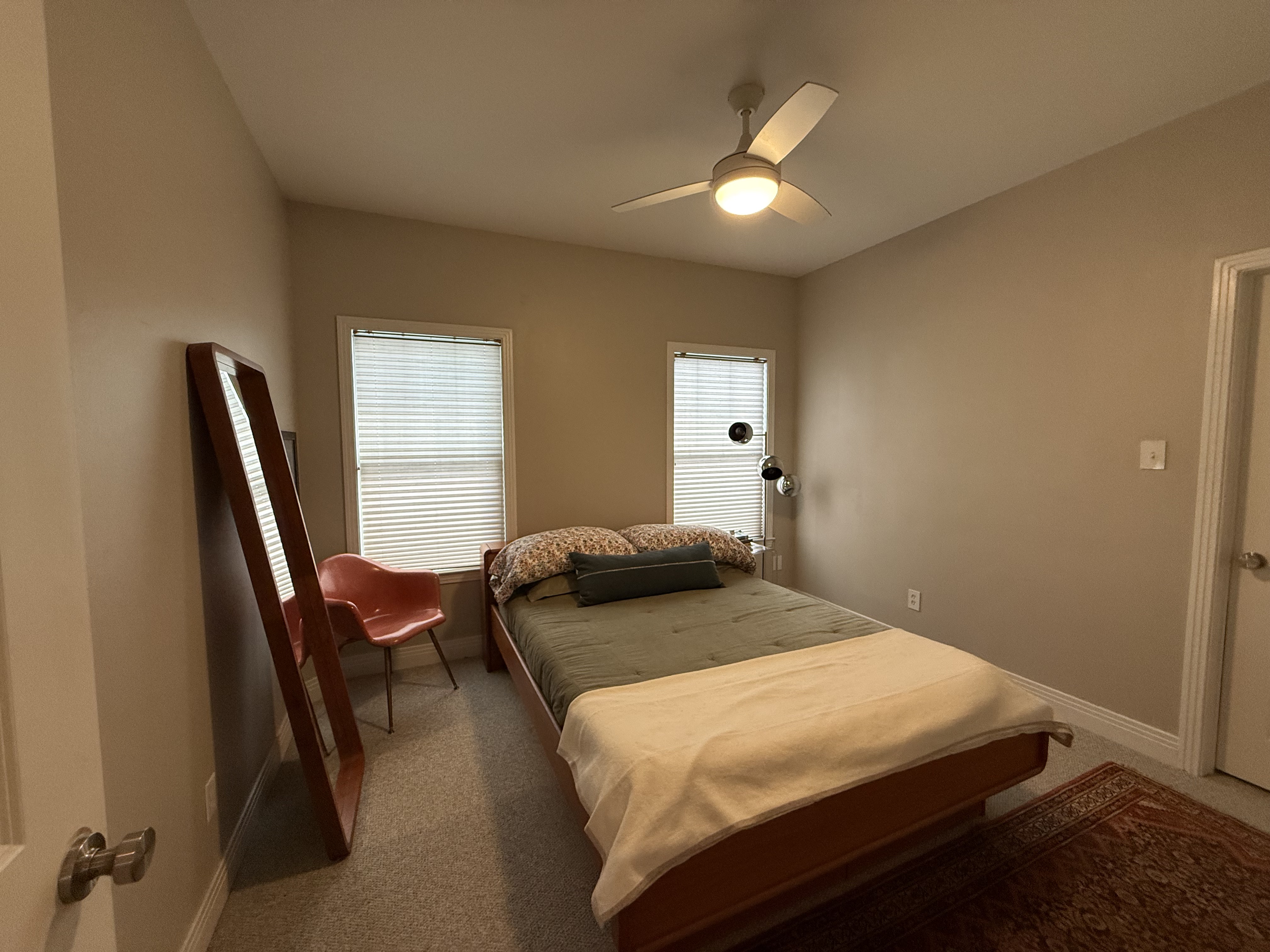 5108 Eilers Avenue Austin, TX 78751 - Photo 9 of 13 a bedroom with a bed and wooden floor