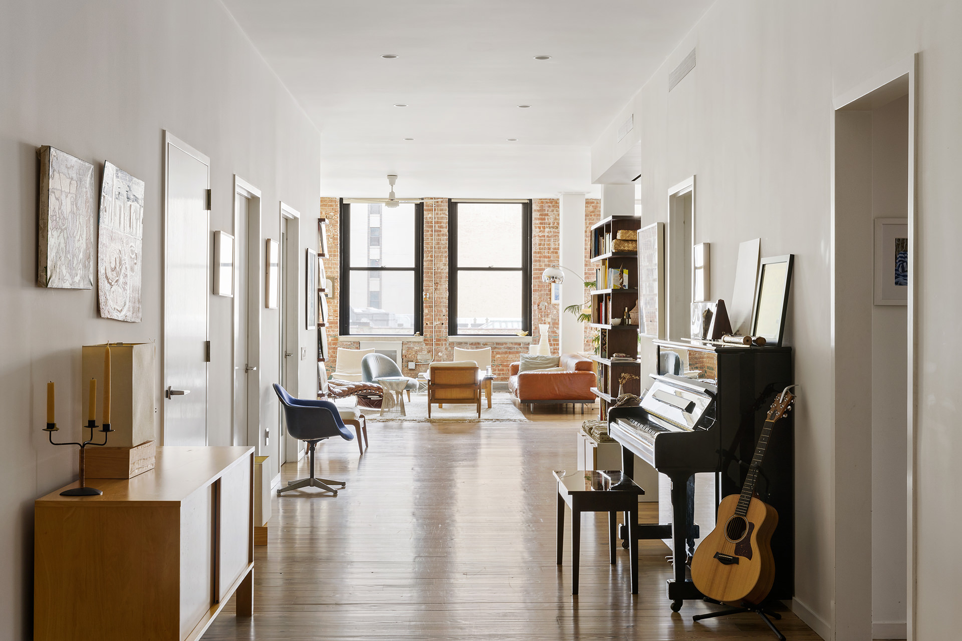 525 West 22nd Street, Unit 3AF Manhattan, NY 10011 - Photo 5 of 25 a living room with furniture floor to ceiling window and floor to ceiling window
