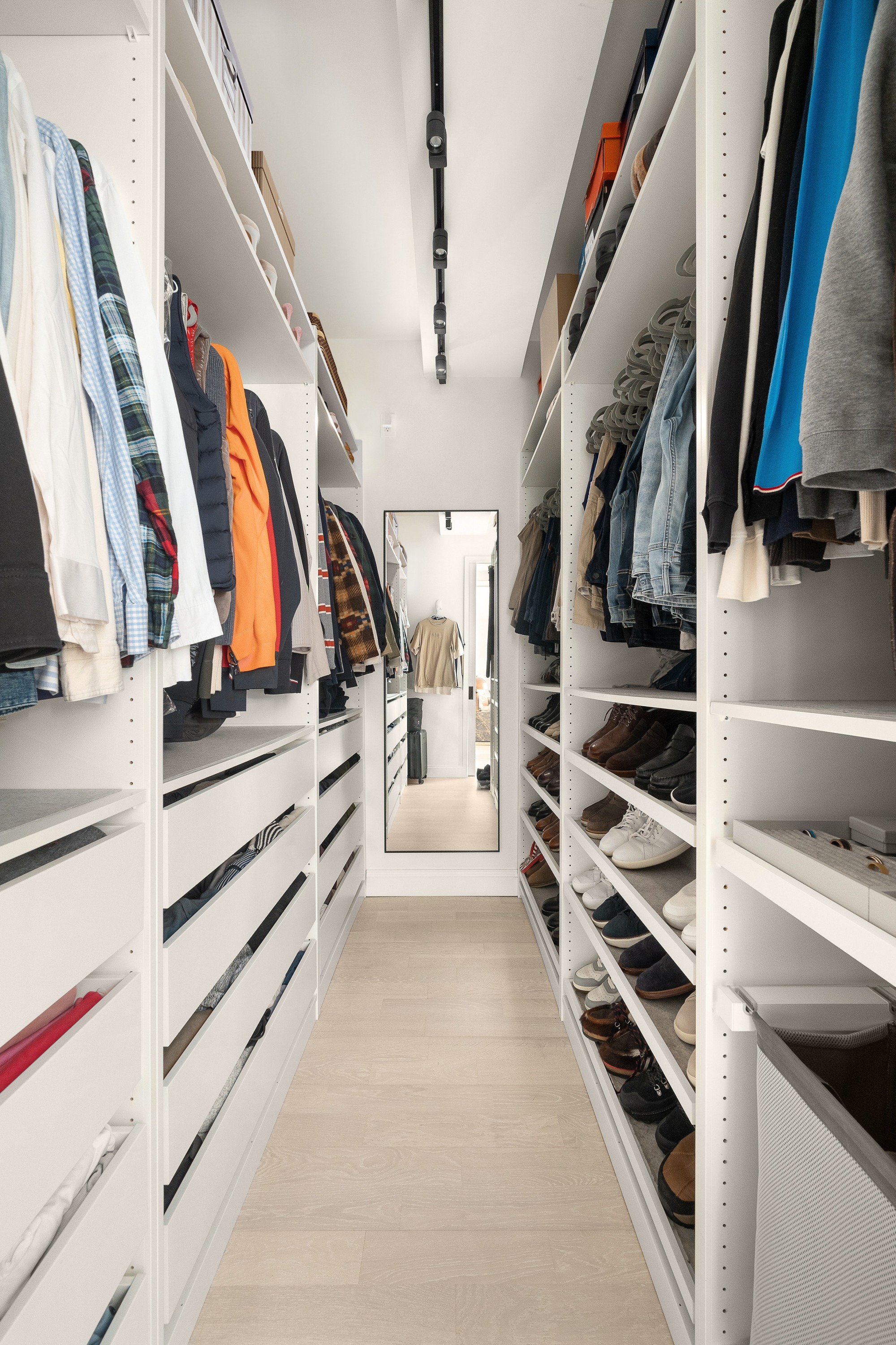 521 West 47th Street, Unit 3B Manhattan, NY 10036 - Photo 14 of 15 a view of walk in closet with clothes and shoes