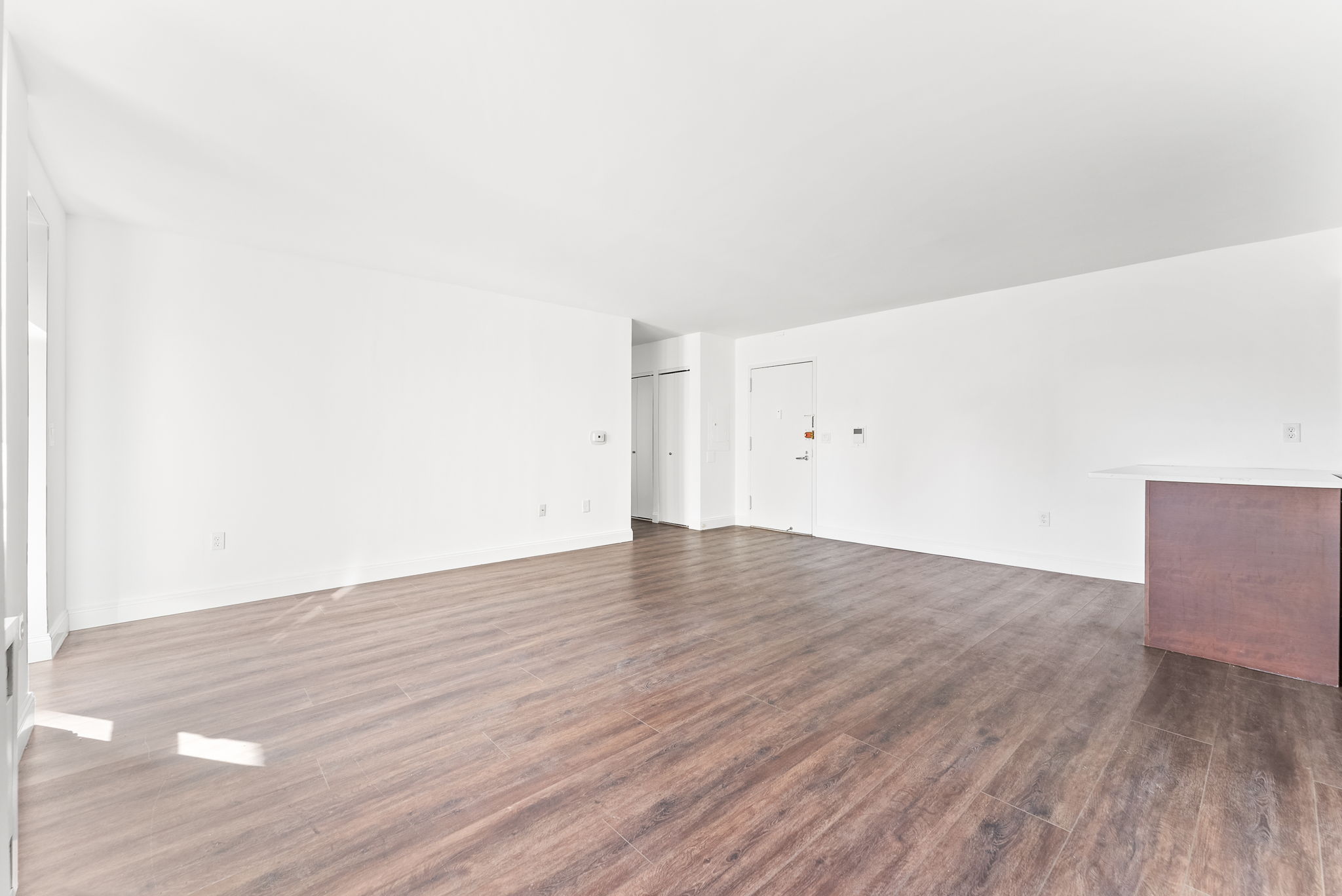 1919 Madison Avenue, Unit 214 Manhattan, NY 10035 - Photo 11 of 19 an empty room with wooden floor