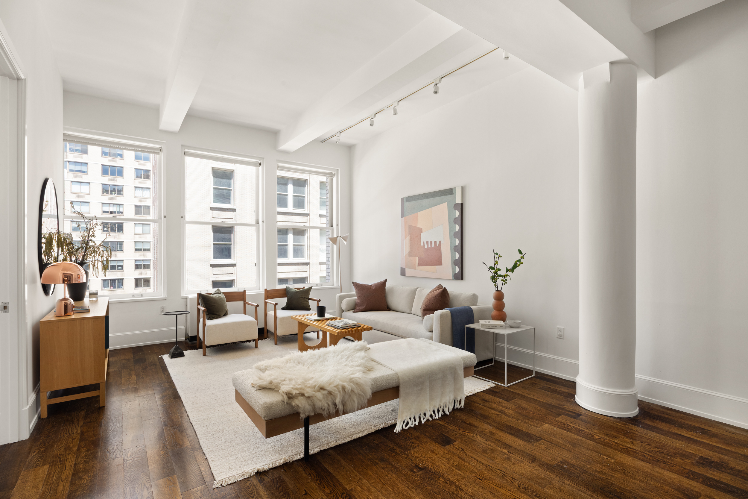 260 Park Avenue South, Unit 9G Manhattan, NY 10010 - Photo 2 of 17 a bedroom with furniture and a large window