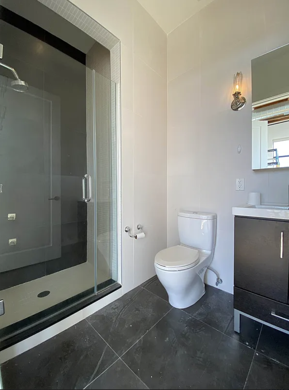 139 North 10th Street, Unit 4B Brooklyn, NY 11249 - Photo 4 of 10 a bathroom with a toilet and a shower