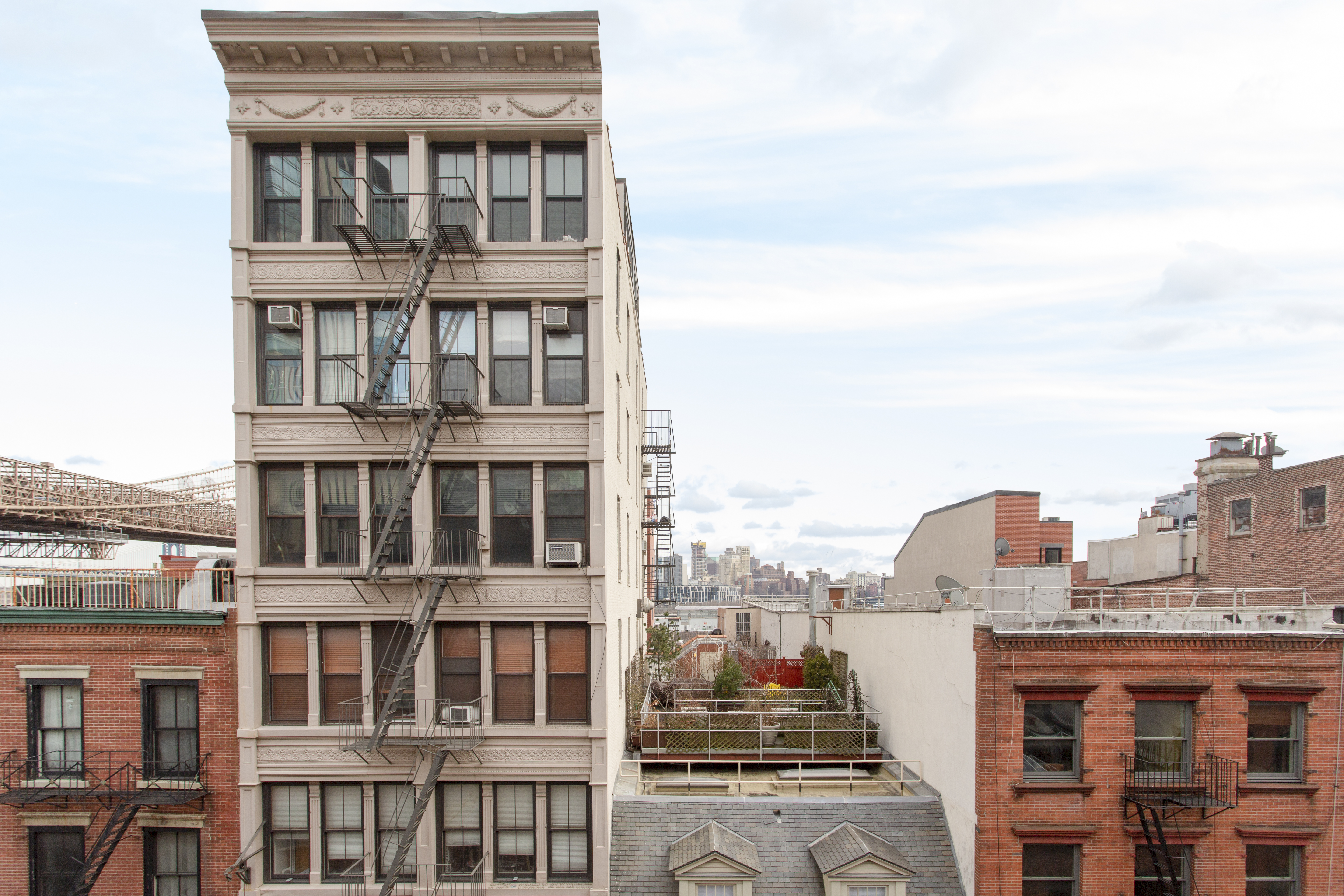 272 Water Street, Unit 5F Manhattan, NY 10038 - Photo 10 of 12 a view of a building with a lot of windows