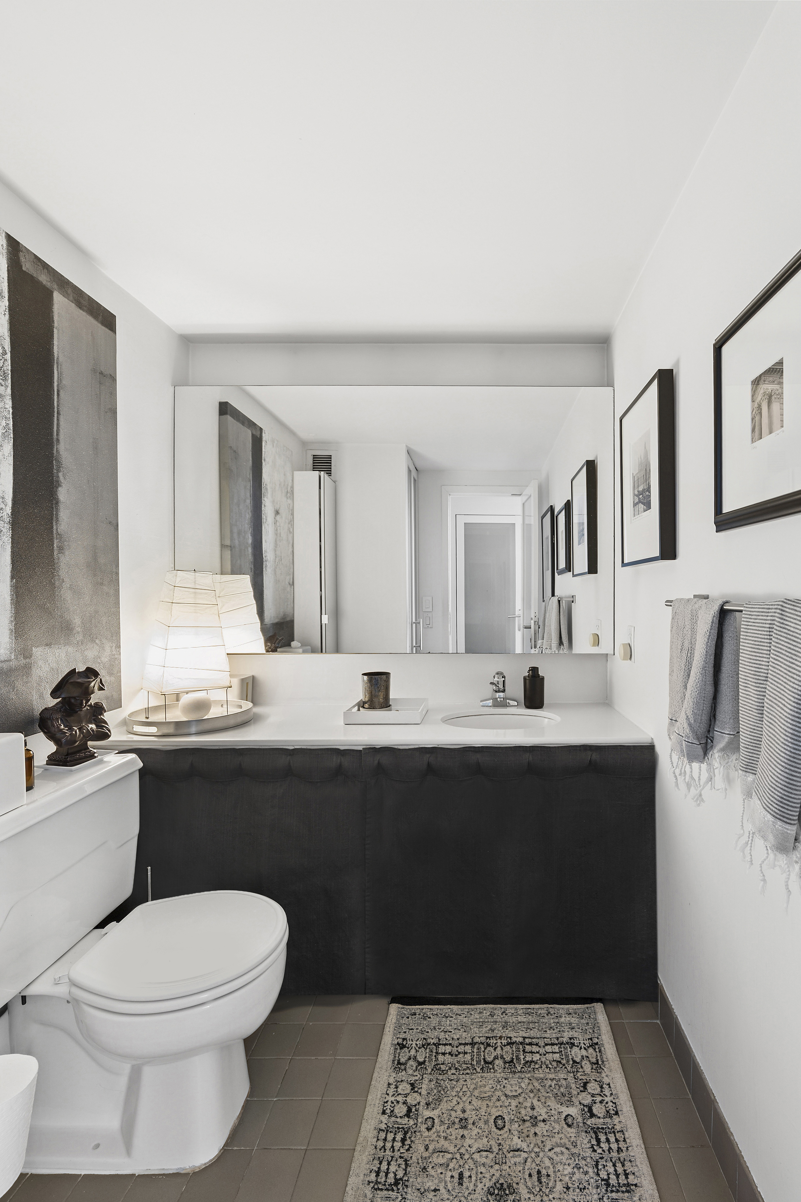 135 West 70th Street, Unit 8A Manhattan, NY 10023 - Photo 9 of 14 a bathroom with a sink and a toilet