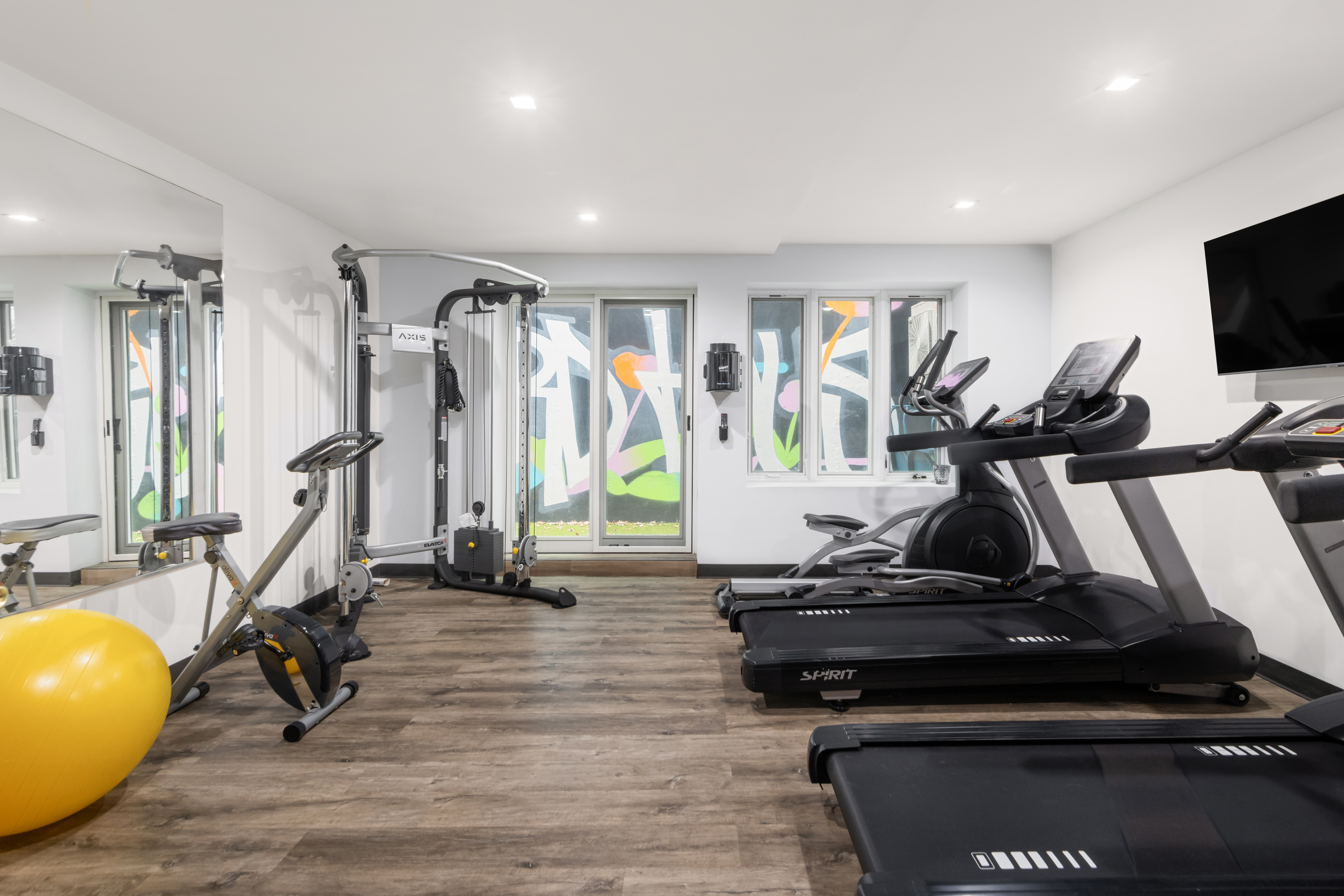 1021 Bedford Avenue, Unit 403 Brooklyn, NY 11205 - Photo 9 of 13 a view of a room with gym equipment