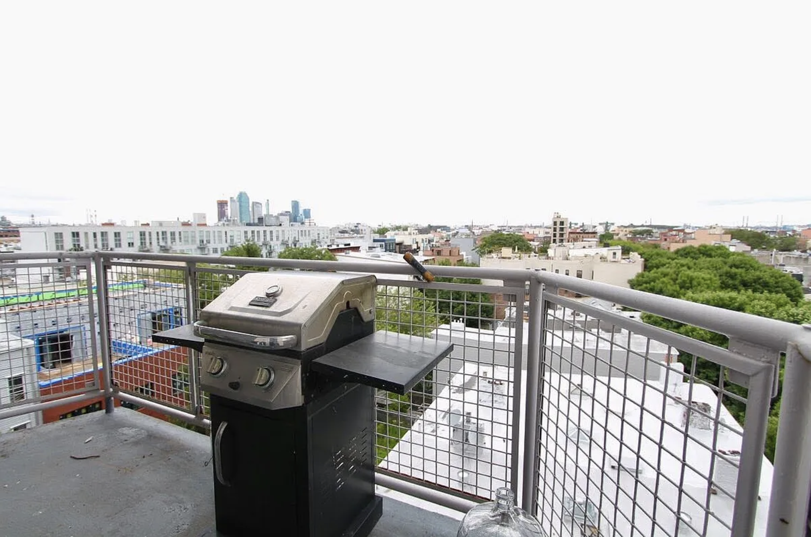 200 Franklin Street, Unit 4B Brooklyn, NY 11222 - Photo 9 of 10 a view of a balcony with wooden floor and iron fence