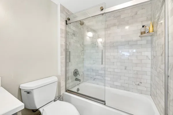 a bathroom with a bathtub and a toilet