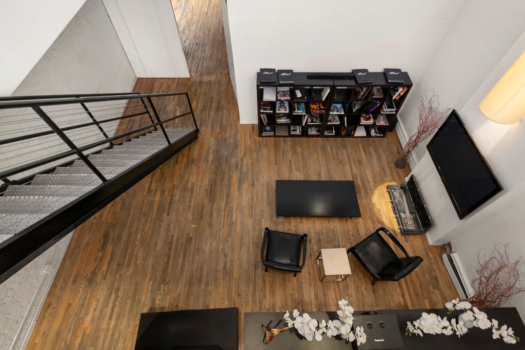 13 Worth Street, Unit 11 Manhattan, NY 10013 - Photo 3 of 9 a view of a living room with furniture and flat screen tv